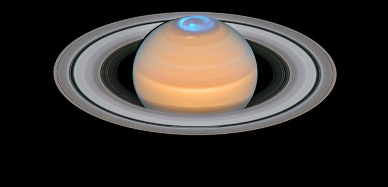 Saturn and its northern auroras (composite image)