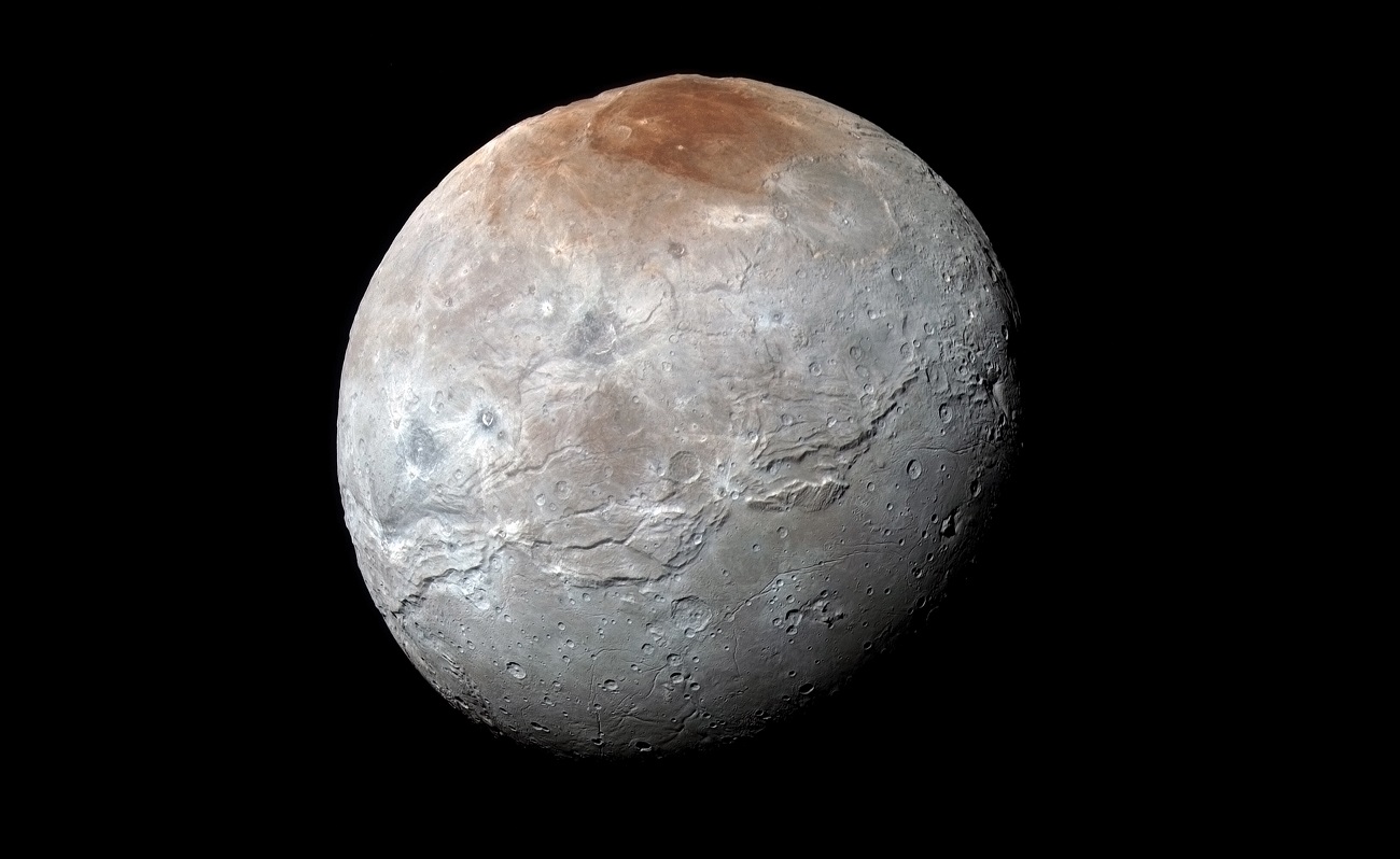 Księżyc Plutona jest pokryty czerwienią. Astronomowie wyjaśniają, skąd mogła się wziąć